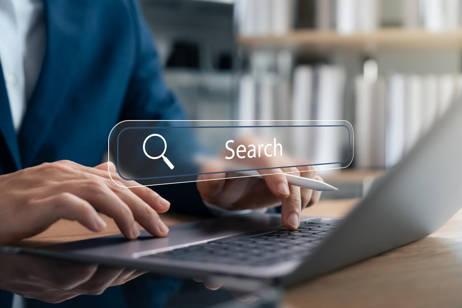 a man using a search engine on his laptop