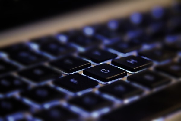 Closeup of glowing backlit computer keyboard