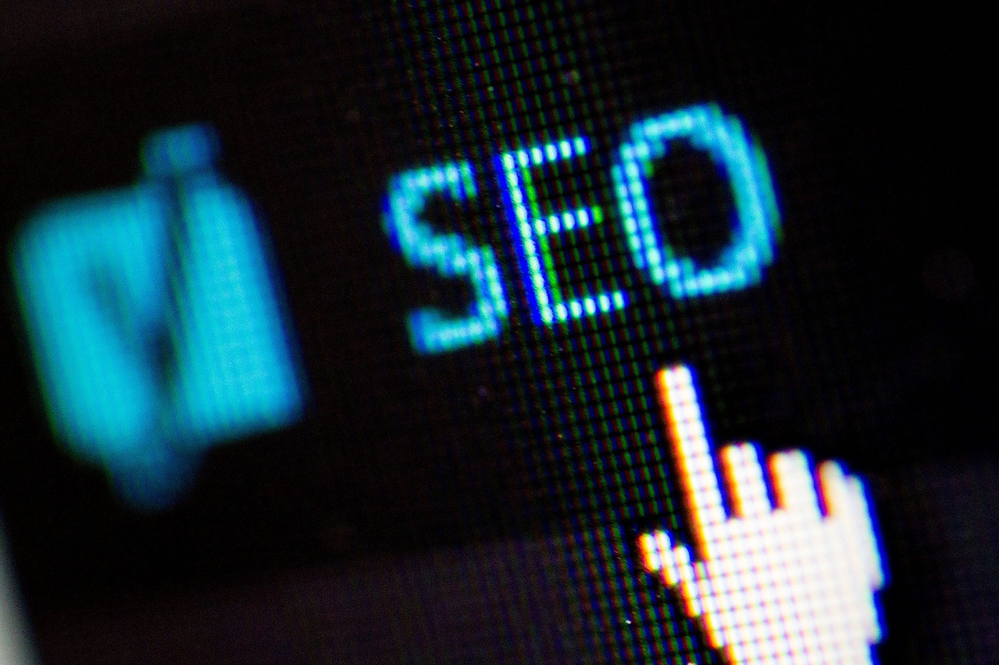 Mouse hand icon hovering over words "SEO"