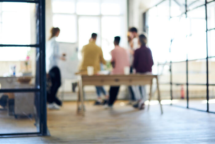 Blurred image of business professionals in a work meeting