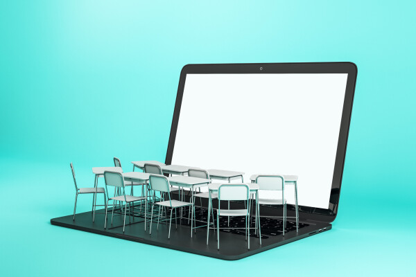 Chairs and tables sitting on top of laptop