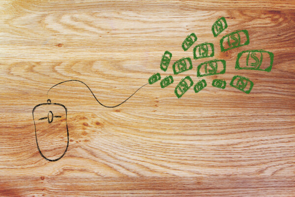 Doodle on table of mouse with cash flowing out