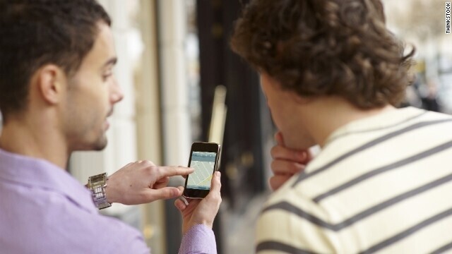 Two people looking at mobile website on smart phone