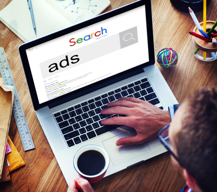 Person searching "ads" in Google