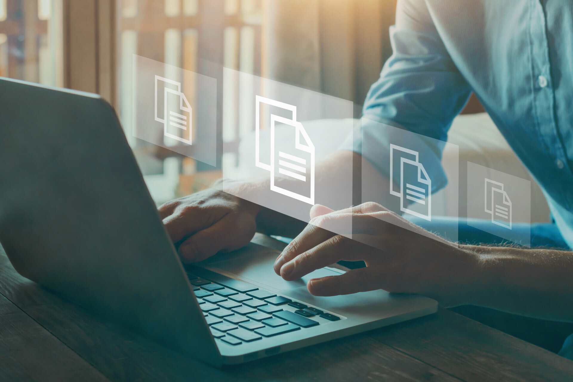 Person working on laptop doing document management