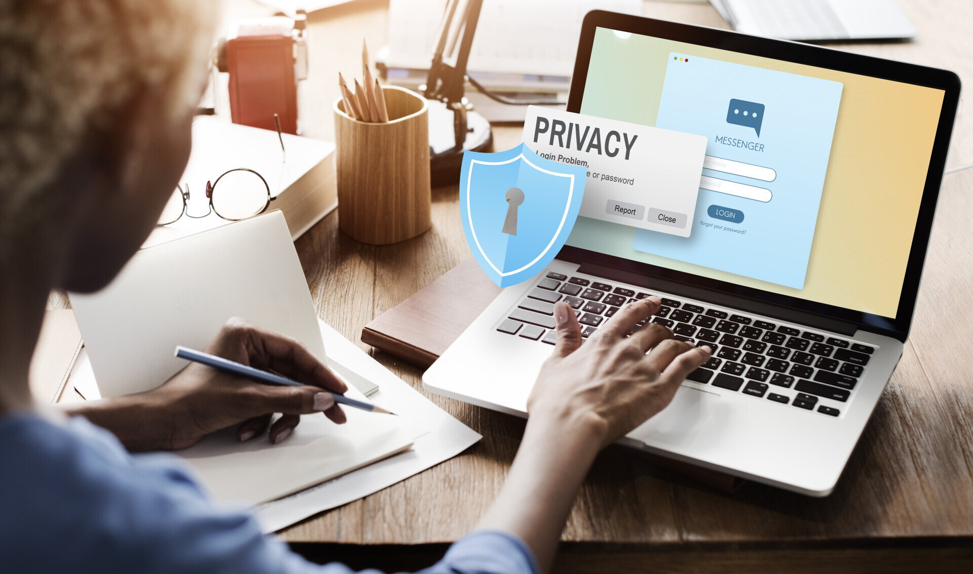 Privacy and shield popping out of a computer screen