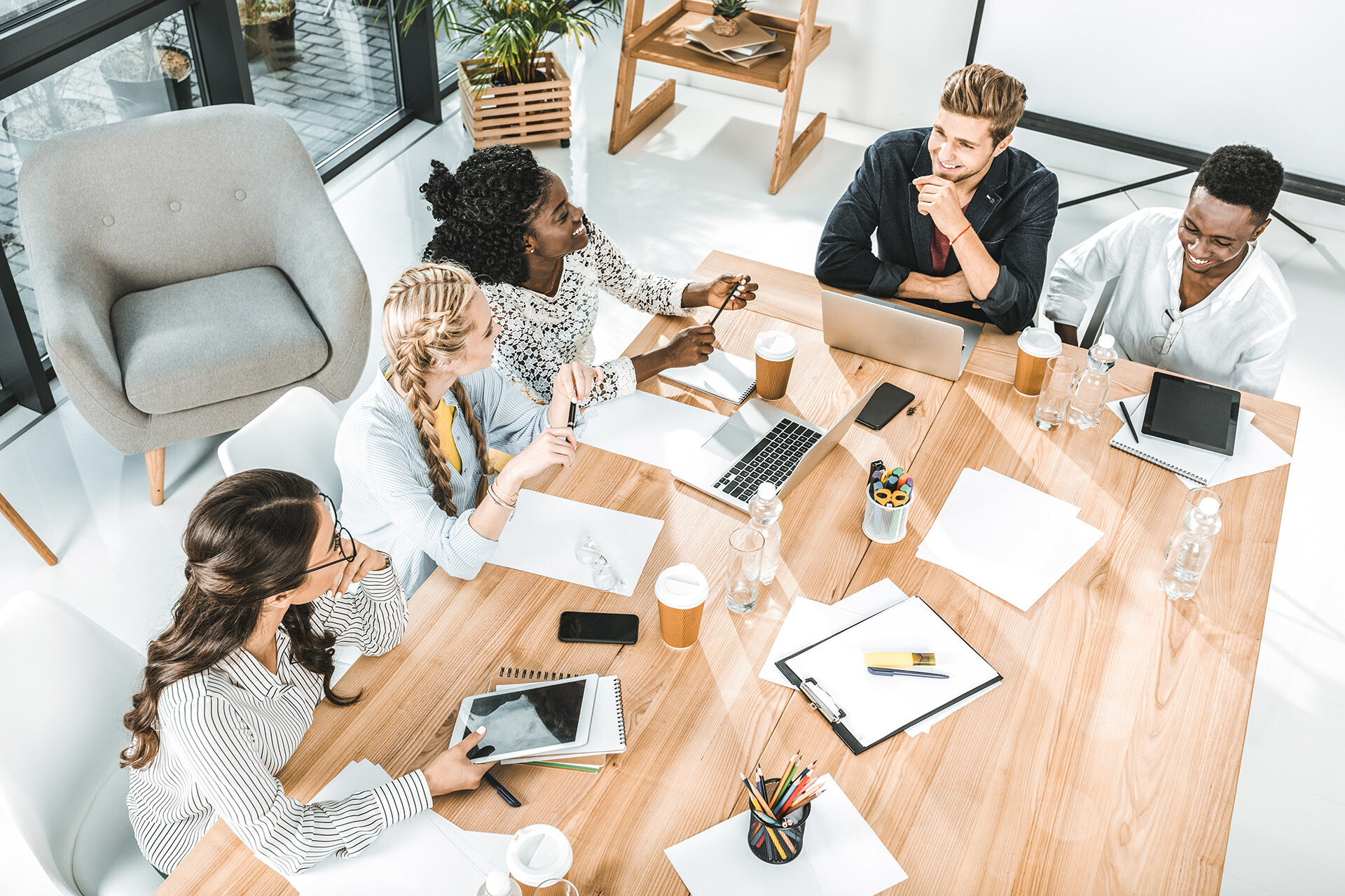 Digital marketing team gathered around table for a meeting